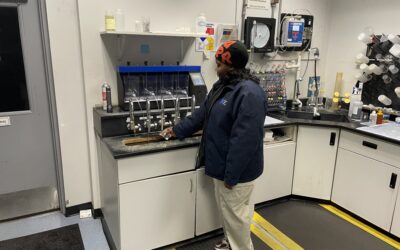 Class III Operator Tiandria Cotton Collecting a Water Sample for Analysis