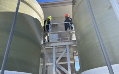 Class III Operators Brian Rancifer and Marquevious Jordan checking levels in the salt brine tanks, a critical component of the sodium hypochlorite generation process.